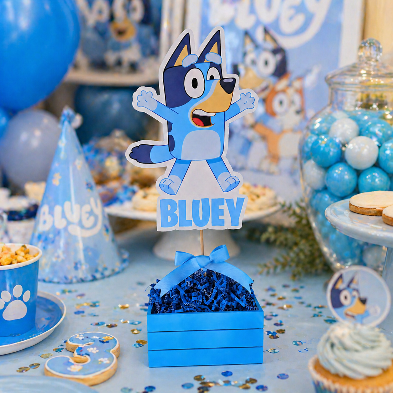 Bluey birthday centerpiece displayed on decorated cake table with balloons and party setup
