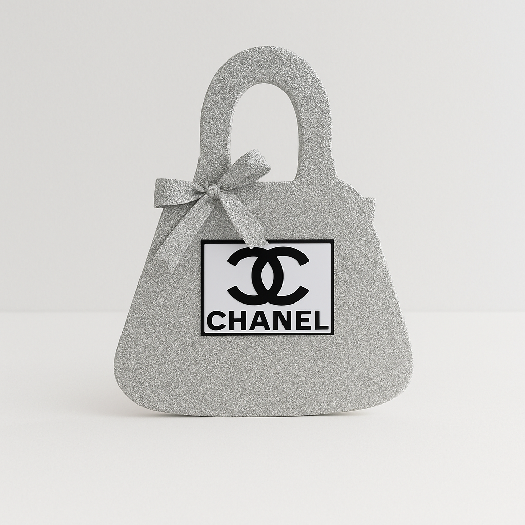 Silver Chanel birthday decorations purse centerpiece, glitter design perfect for Chanel birthday party theme.