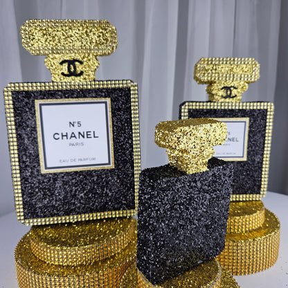 black and gold chanel birthday decorations Black Gold Chanel-inspired perfume bottle centerpiece for luxury glam birthday decor