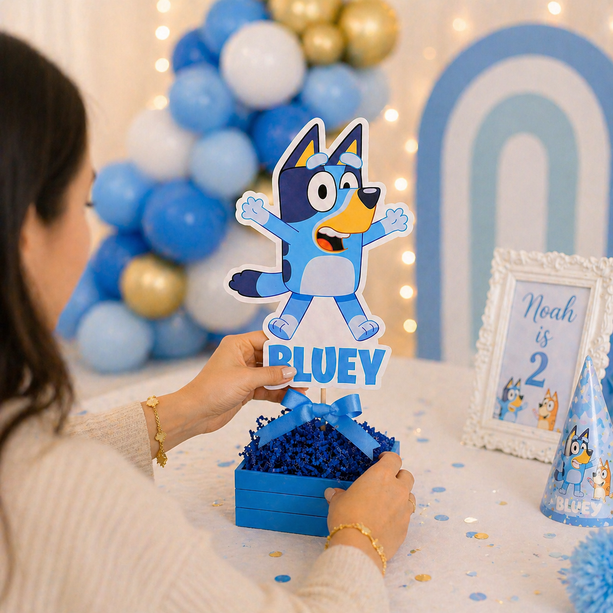 bluey centerpieces being placed on birthday party table