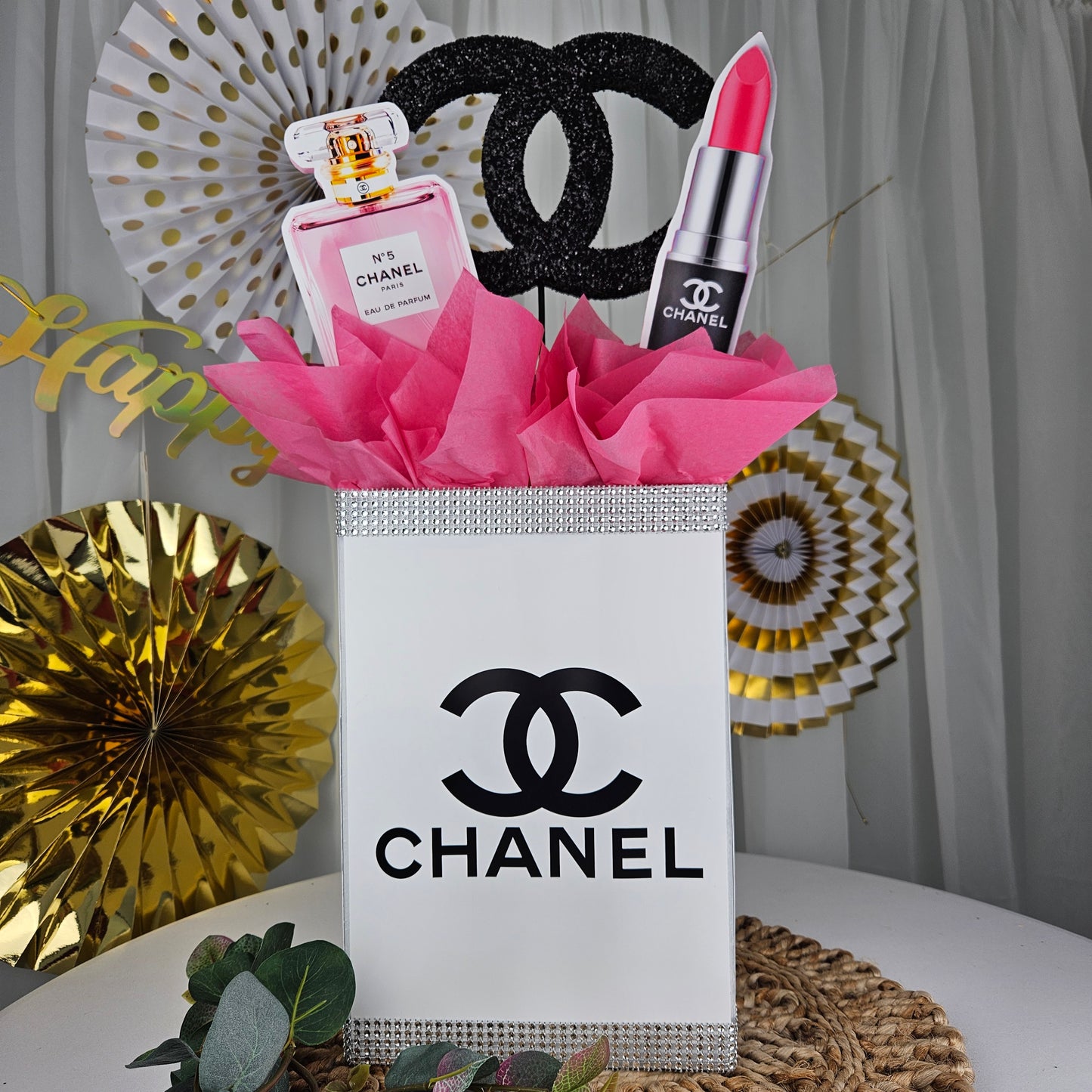 Chanel inspired gift box centerpiece for glam Paris themed birthday party decor