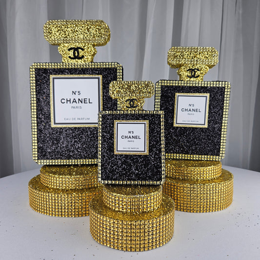 Chanel-inspired perfume bottle centerpiece for luxury glam birthday decor