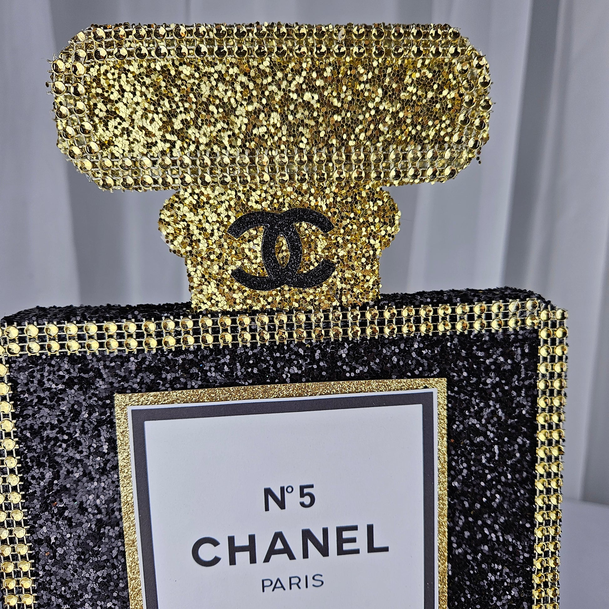 black and gold chanel birthday decorations Chanel-inspired birthday centerpiece perfume bottle design