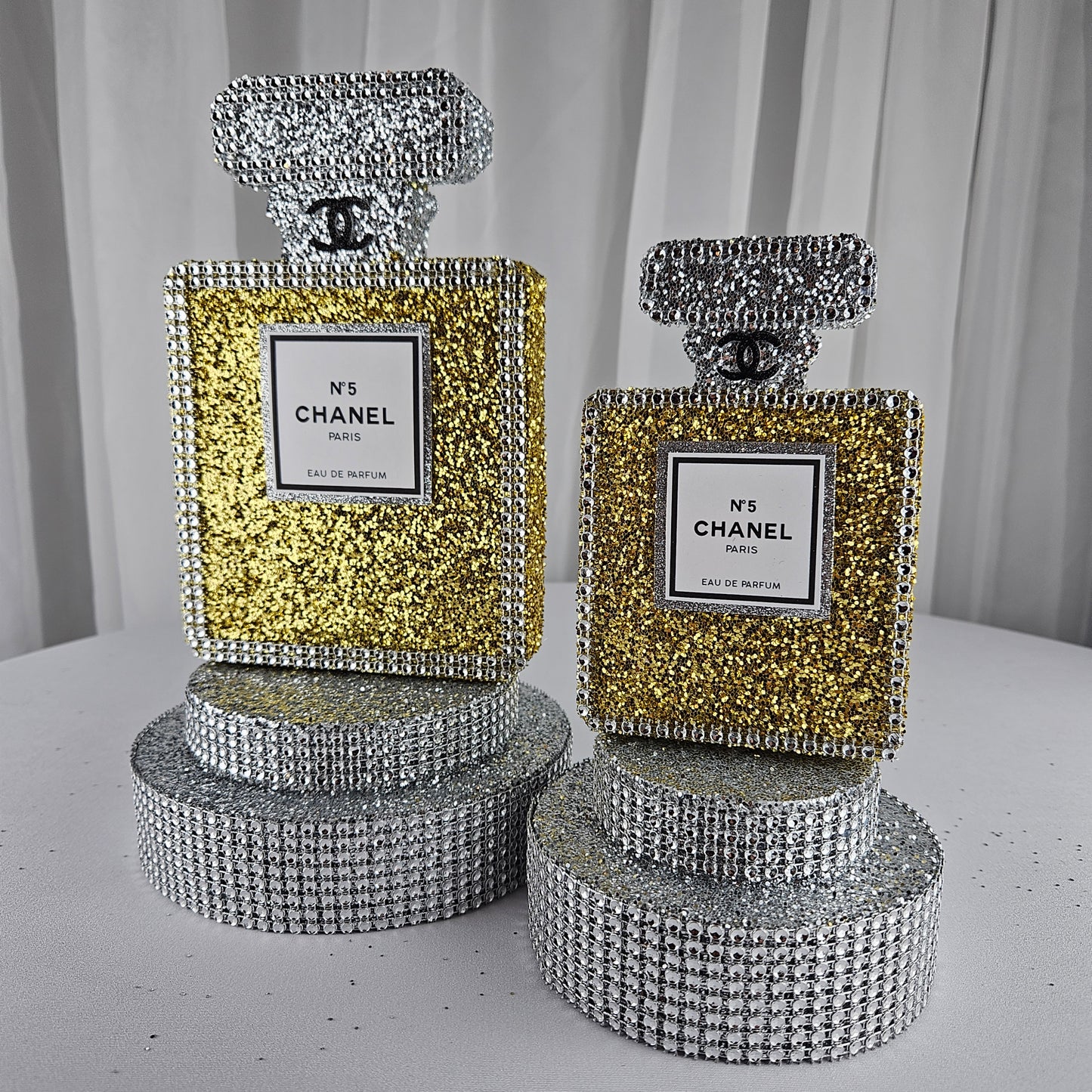 gold chanel birthday decorations Luxury gold and silver perfume bottle centerpiece for Chanel party decorations and Paris themed birthday decor