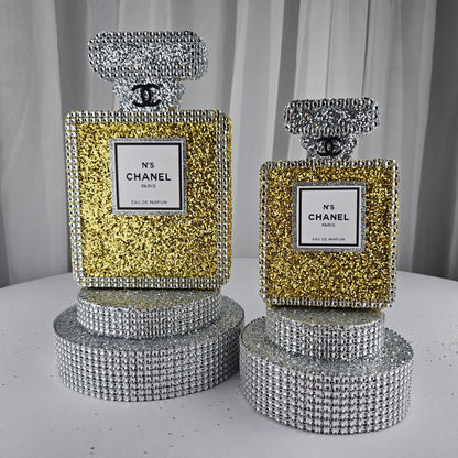 gold chanel birthday decorations Styled Chanel inspired perfume bottle centerpiece with luxury party setup for glam birthday decorations