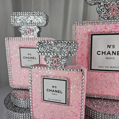 pink chanel birthday decorations Glitter detail on pink and silver Chanel inspired centerpiece for luxury birthday party