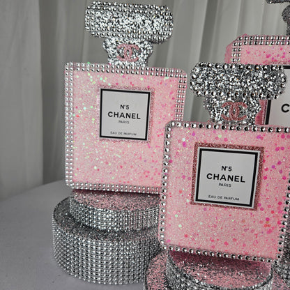 pink chanel birthday decorations Size comparison of Chanel inspired pink and silver perfume centerpiece for party table