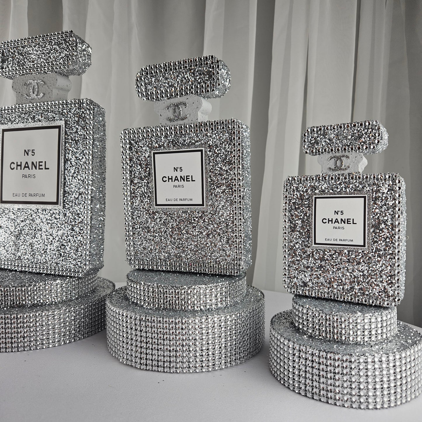 Glitter detail on silver Chanel inspired centerpiece for luxury birthday party