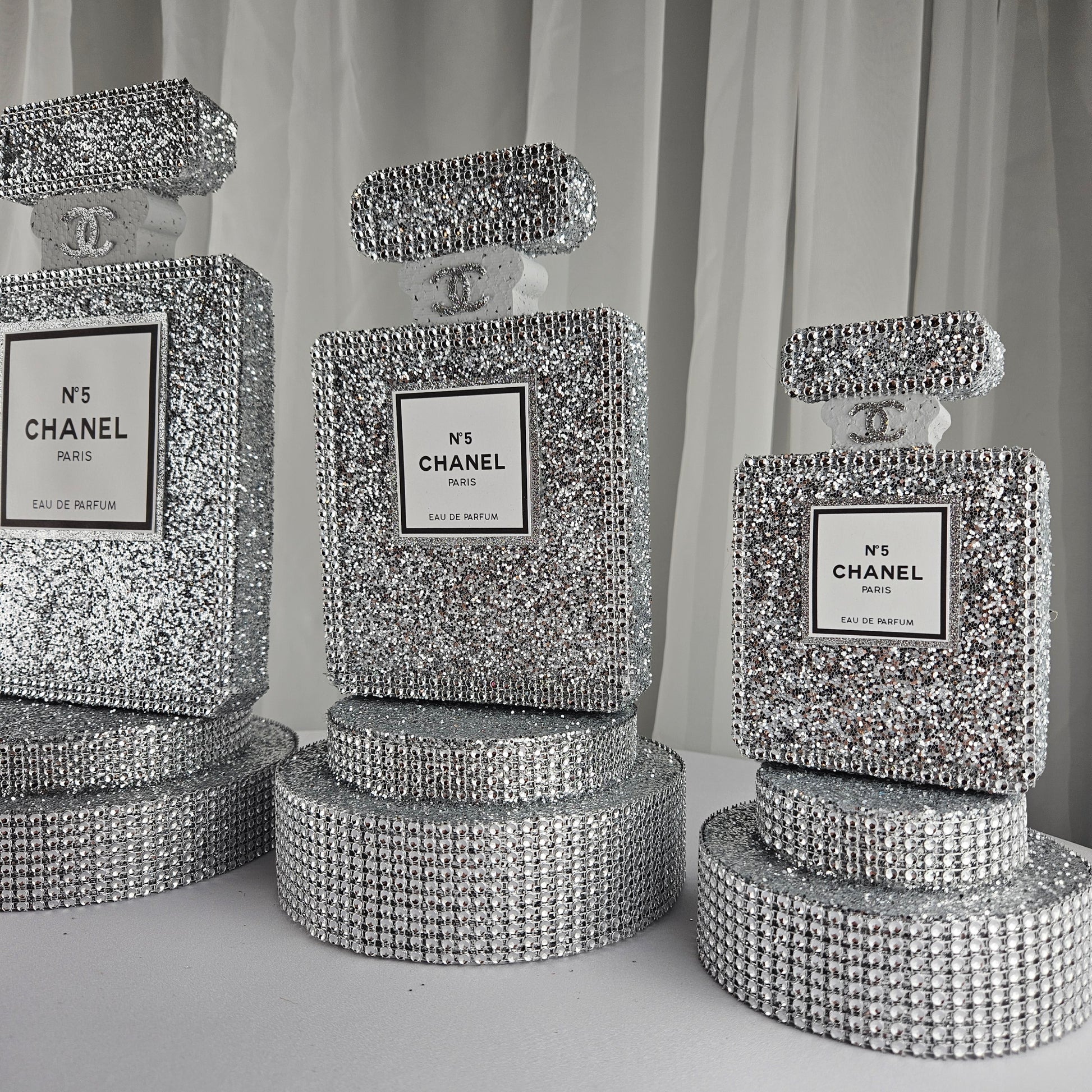 Glitter detail on silver Chanel inspired centerpiece for luxury birthday party