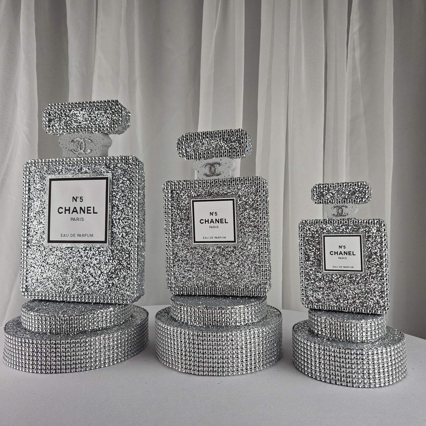 Handmade foam Chanel inspired silver perfume centerpiece for glam parties