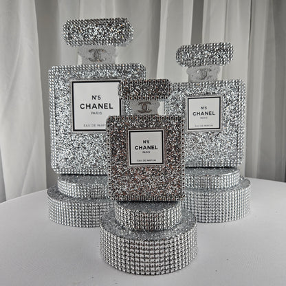 Chanel inspired silver perfume centerpiece for glam Paris themed birthday party decor


