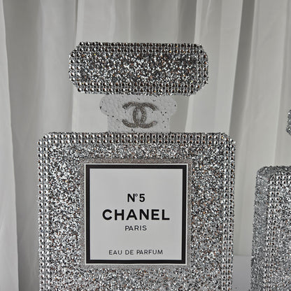 Set of silver Chanel inspired perfume centerpieces for Paris themed birthday decor