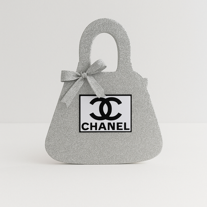 Silver Chanel birthday decorations purse centerpiece, glitter design perfect for Chanel birthday party theme.


