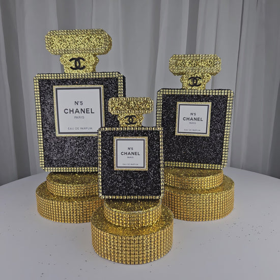 Chanel-inspired black and gold birthday centerpiece for Paris themed party