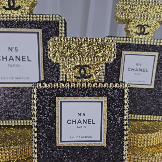Glam Chanel-style perfume bottle centerpiece for luxury birthday celebrations